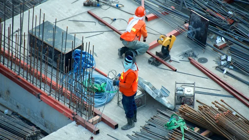 Professional chimney sweep at work on a rooftop